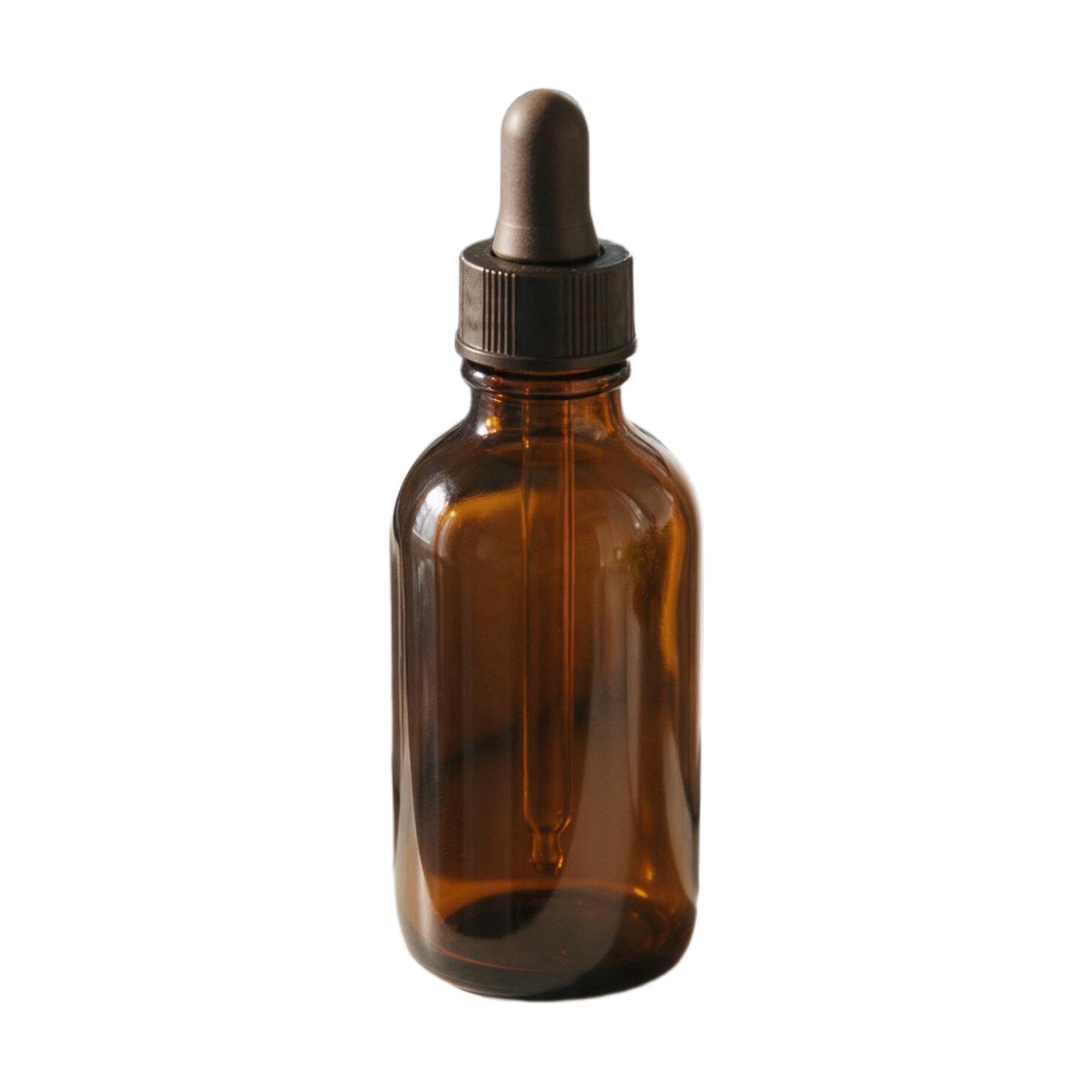 AI-edited amber dropper bottle centred on a pure white square background